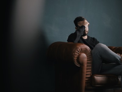 Male Sitting alone on Leather Chair