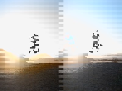 man jumping in air on mountain