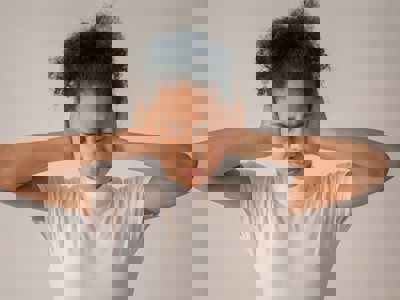 person covering ears eyes closed