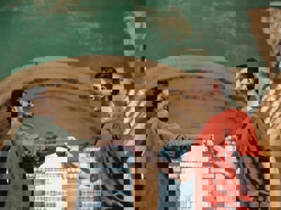 two men bumping fists together
