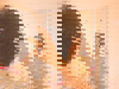 teen looking at themselves in mirror